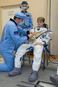 NASA Astronaut Anne McClain Suits Up in a Russian Sokol launch and entry suit